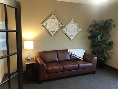 Cozy lounge area with a couch and decor