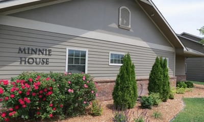 Exterior view of Minnie's House with landscaping