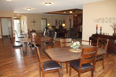 Interior view of a dining room with wooden tables.