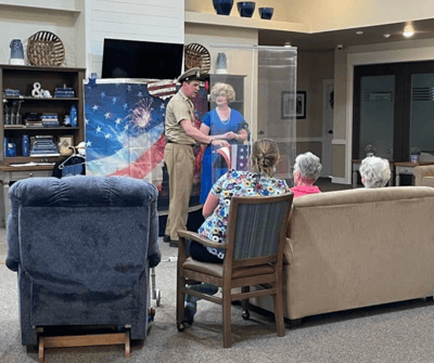 Residents enjoying a performance in a common area.