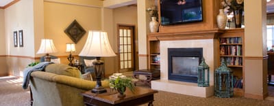 Cozy common area with seating and a fireplace