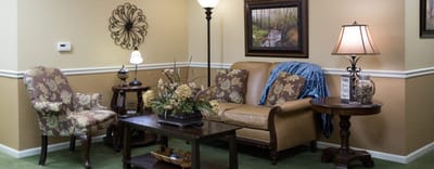 Well-decorated common area with seating and plants