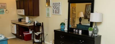 Cozy interior of a resident room with kitchenette