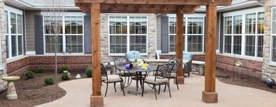 Outdoor seating area with tables and chairs in a courtyard