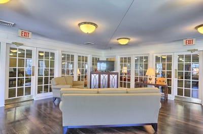 Interior common area with seating and exit signs