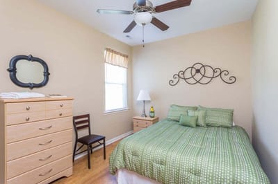 Cozy private bedroom with a queen-sized bed and dresser