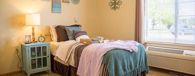 Cozy resident room with bed and decor
