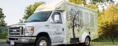 Facility transport vehicle with branding
