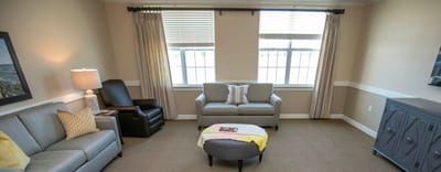 Bright common area with seating and natural light