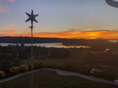 Sunset view over a serene landscape with water