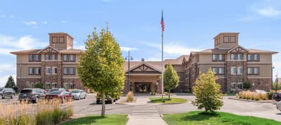 Exterior view of Bethesda Gardens Thornton facility with landscaped entrance