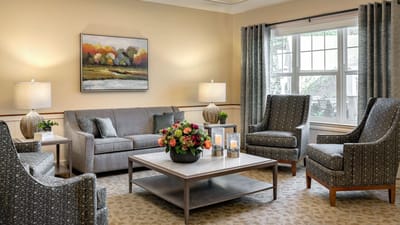 Bright lobby area with comfortable seating and floral arrangements