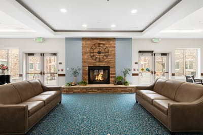 Cozy lobby with sofas and a fireplace