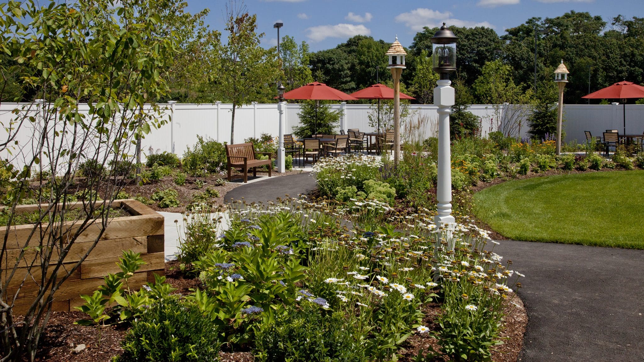 Beautifully landscaped outdoor garden area with seating