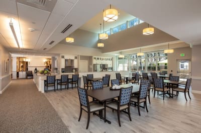 Bright and spacious dining room with tables and chairs