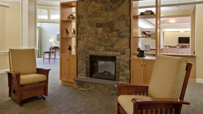 Cozy common area with a stone fireplace