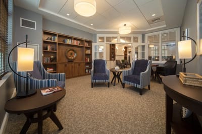 Cozy common area with comfortable seating and bookshelves