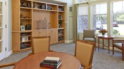 Interior common area with chairs and bookshelves