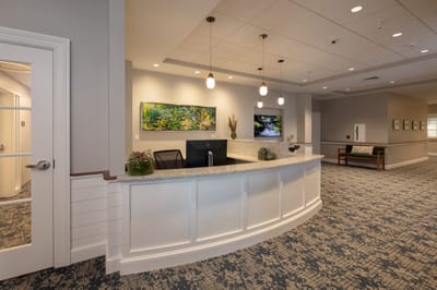 Interior view of a lobby with a reception desk