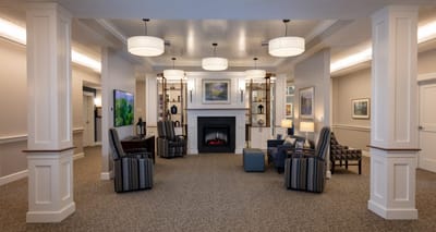 Bright common area with seating and artwork on walls