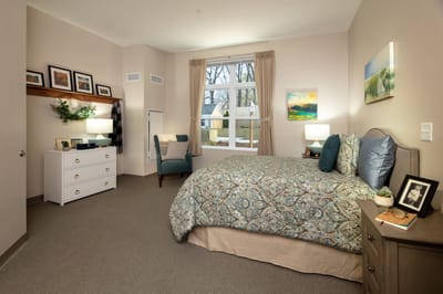 Cozy private resident room with bed and decor