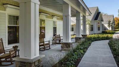 Outdoor patio with rocking chairs and garden