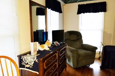 Cozy interior of a resident's space with a chair and TV