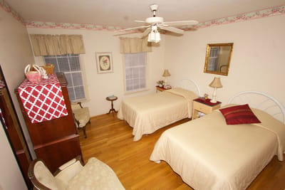 Cozy resident room with two beds and warm decor