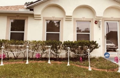 Exterior view of a facility with garden decorations