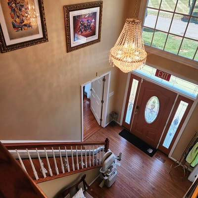View of the interior foyer with chandelier and staircase