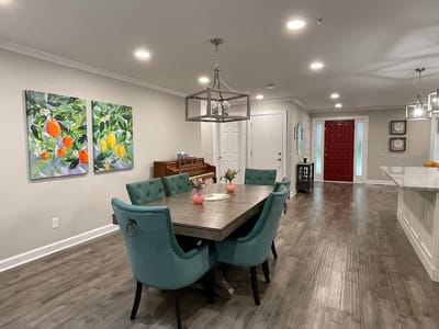 Bright dining area with colorful artwork
