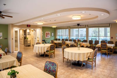 Bright dining room with tables and chairs