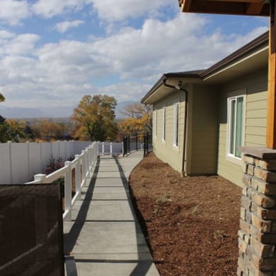 Pathway leading to the facility with landscaping