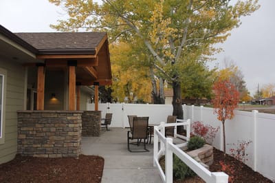 Outdoor patio area with seating and trees