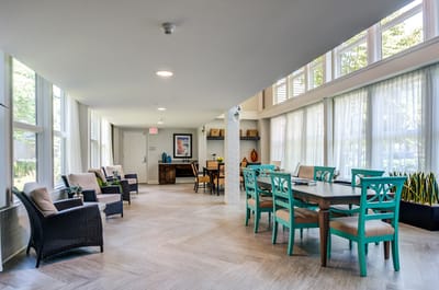 Bright and inviting common area with seating and tables