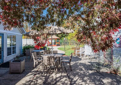 Outdoor patio area with tables and umbrellas