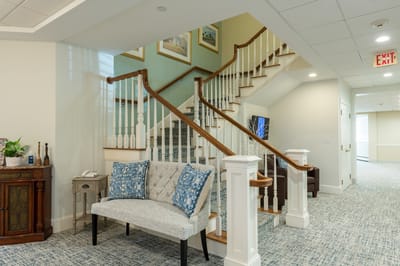 Interior view of a welcoming lobby with stairs