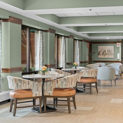Bright common area with seating and large windows