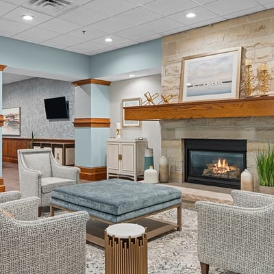 Cozy lobby area with a fireplace and seating