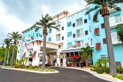 Exterior view of Bahama Bay Club with people outside