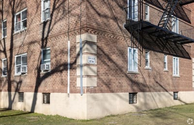 Building exterior with windows and fire escape