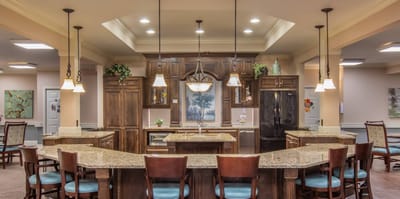 A well-lit interior kitchen area with seating