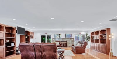 Bright and spacious common area with seating and shelves