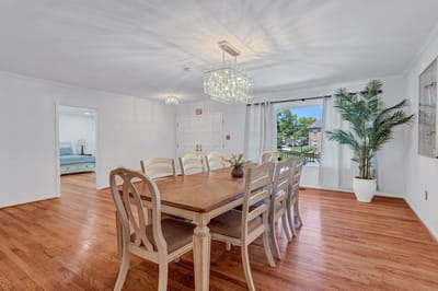 Bright dining area with a wooden table and chairs
