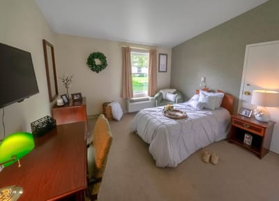 Cozy resident room with a bed and desk