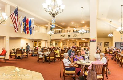 Residents enjoying a meal in the dining room