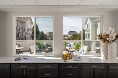 Bright interior space with large windows overlooking a patio