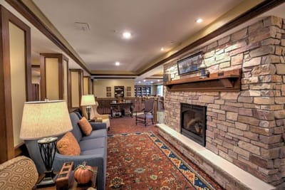 Cozy common area with a fireplace and bookshelves