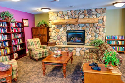 Cozy common area with seating and bookshelves
