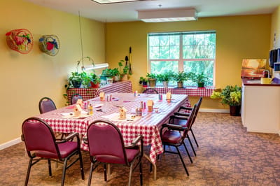 Bright dining room with tables set for a meal